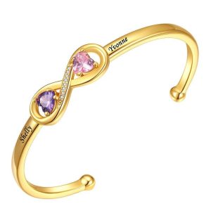 Open heart cuff with two engraved names and two birthstone accents — Gold Tone