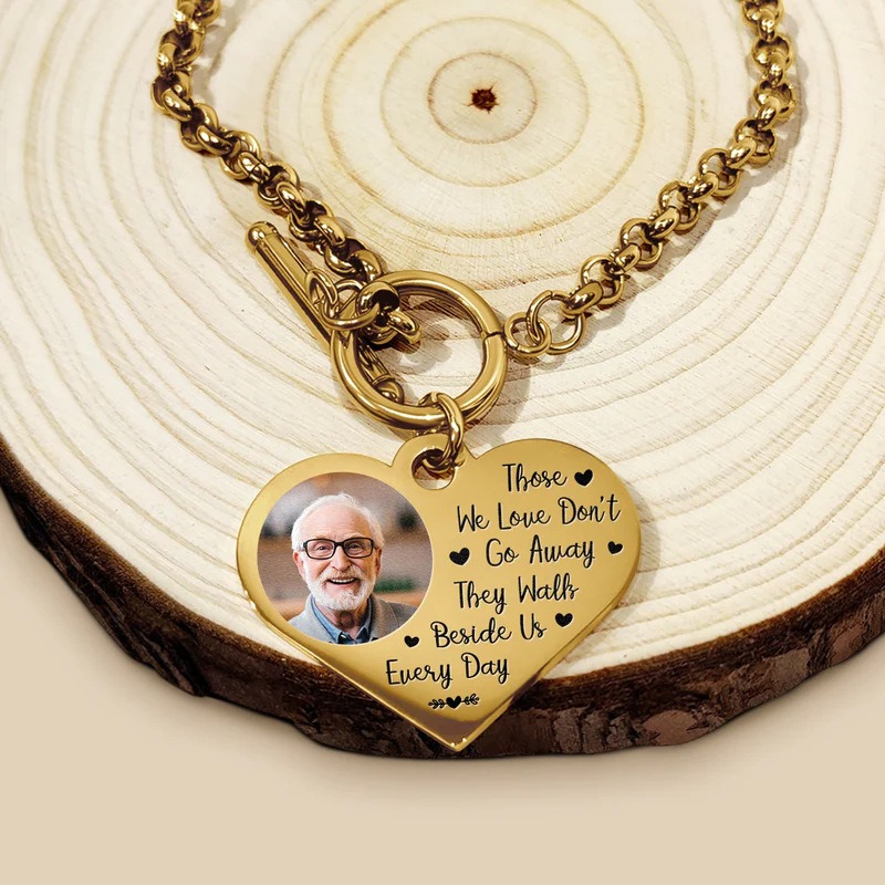 Double sided photo heart bracelet with engraved message in rose gold