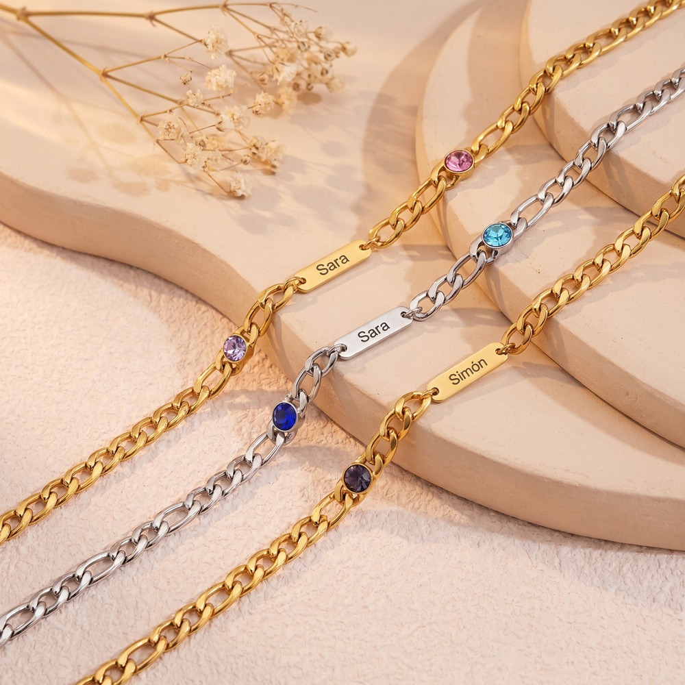 Stainless steel Cuban link necklace with a custom engraved name bar and a single birthstone charm