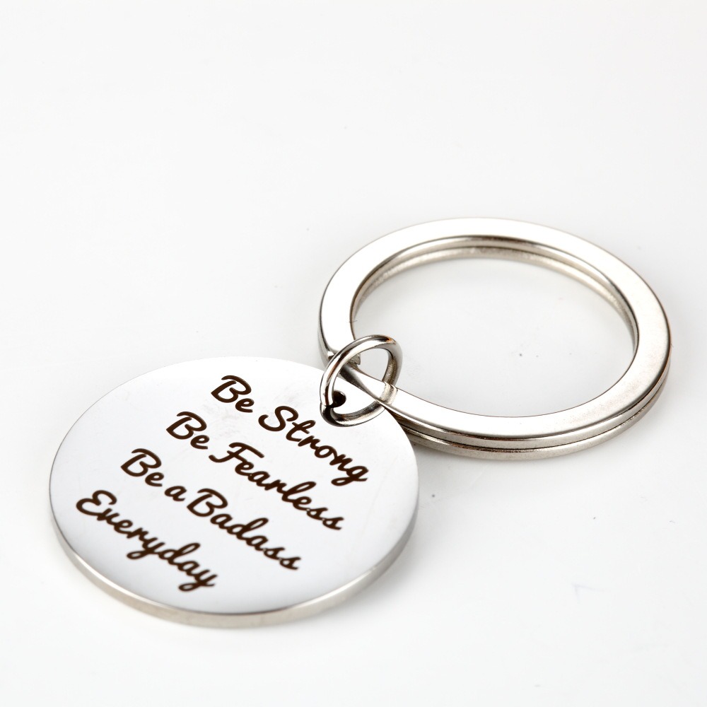 Stainless steel keychain with a custom engraved name and a birthstone charm