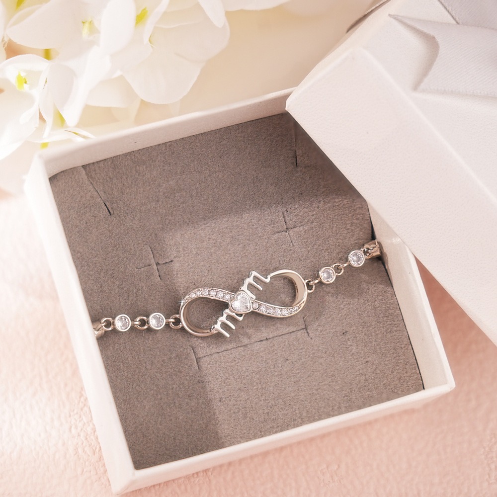 Stainless steel MOM infinity bracelet with single-line engraving and a birthstone accent
