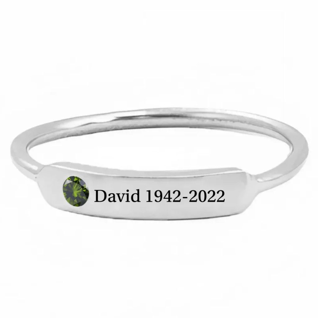Minimalist stainless steel ring with cubic zirconia accent and one line of engraving