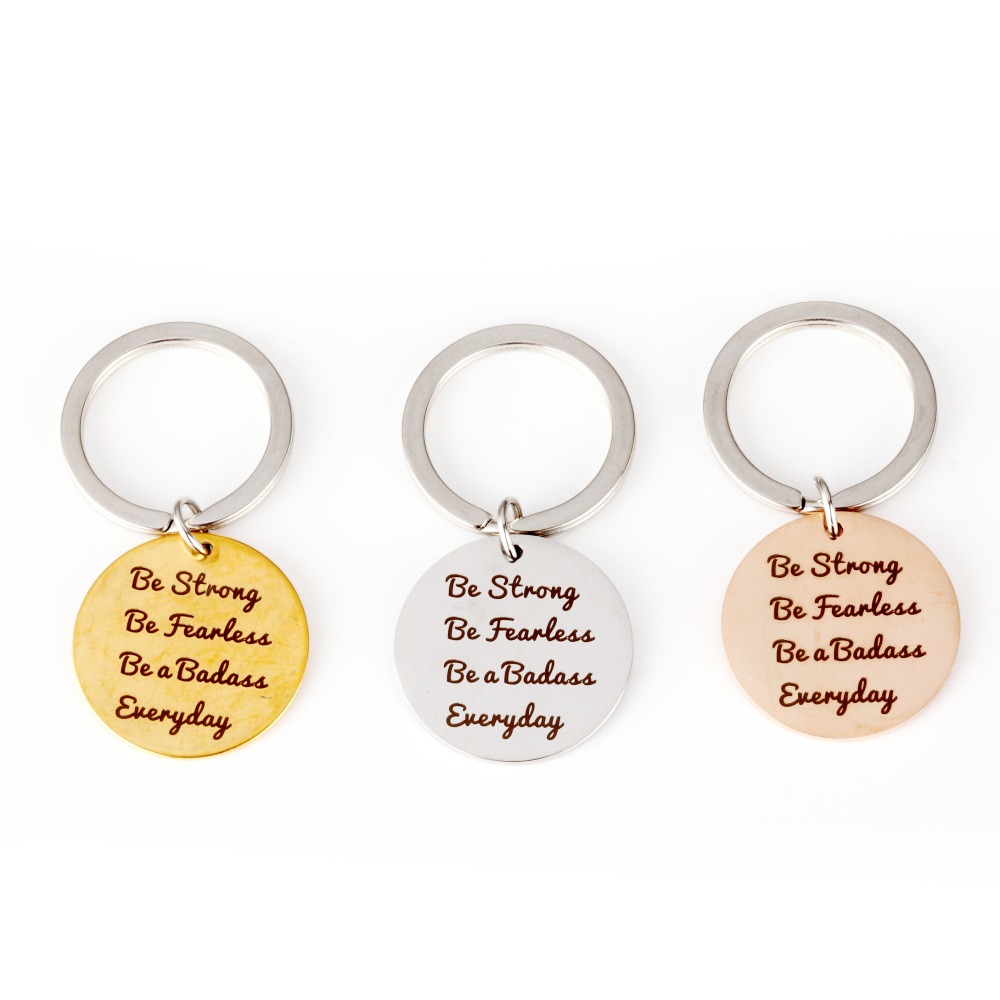 Stainless steel keychain with a custom engraved name and a birthstone charm