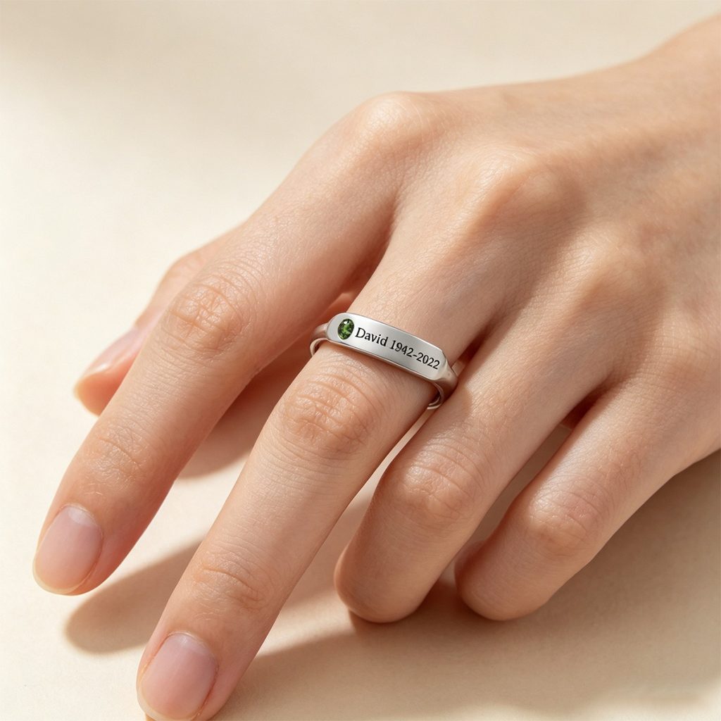 Minimalist stainless steel ring with cubic zirconia accent and one line of engraving