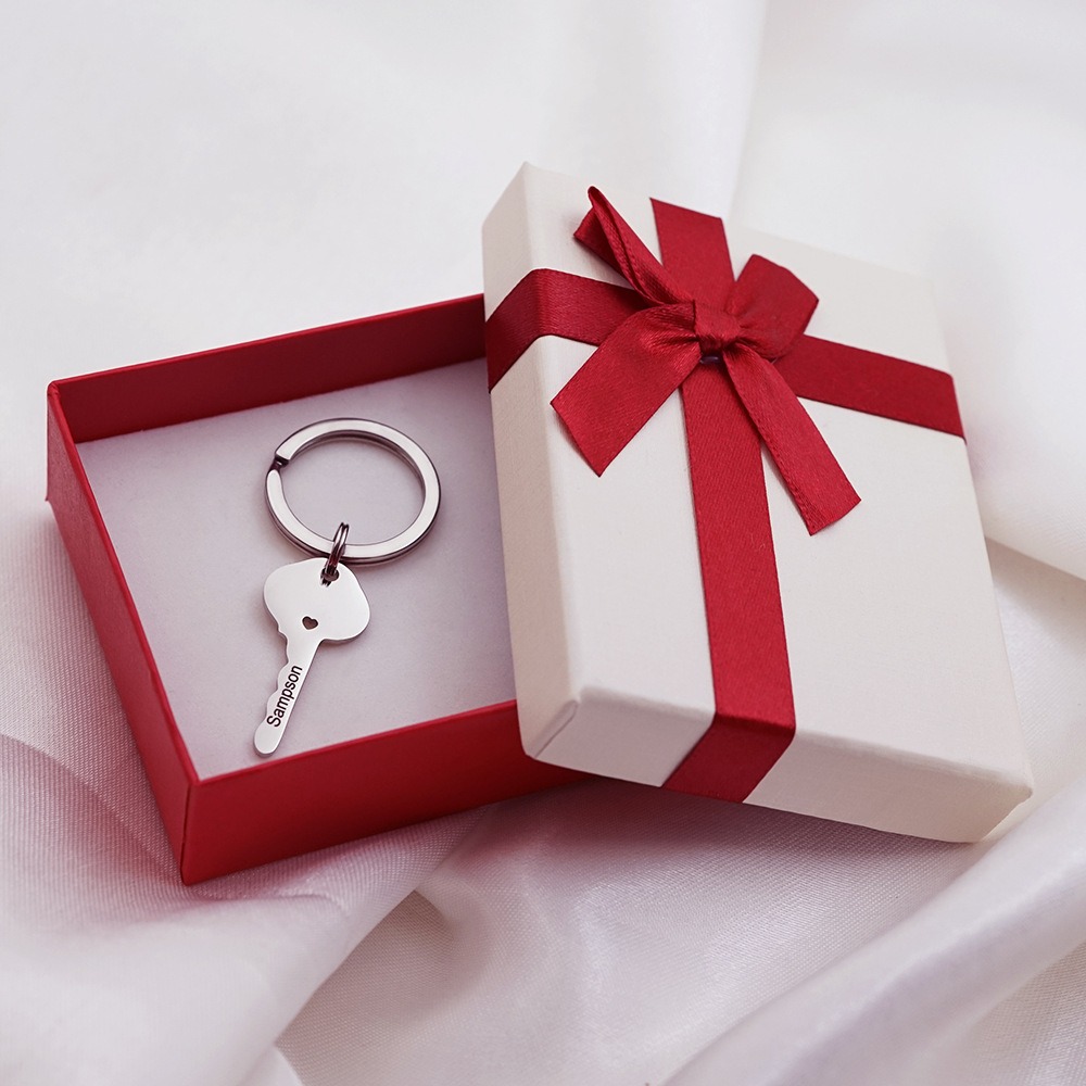 Stainless steel heart lock couple keychain with two engraved names and birthstone accents