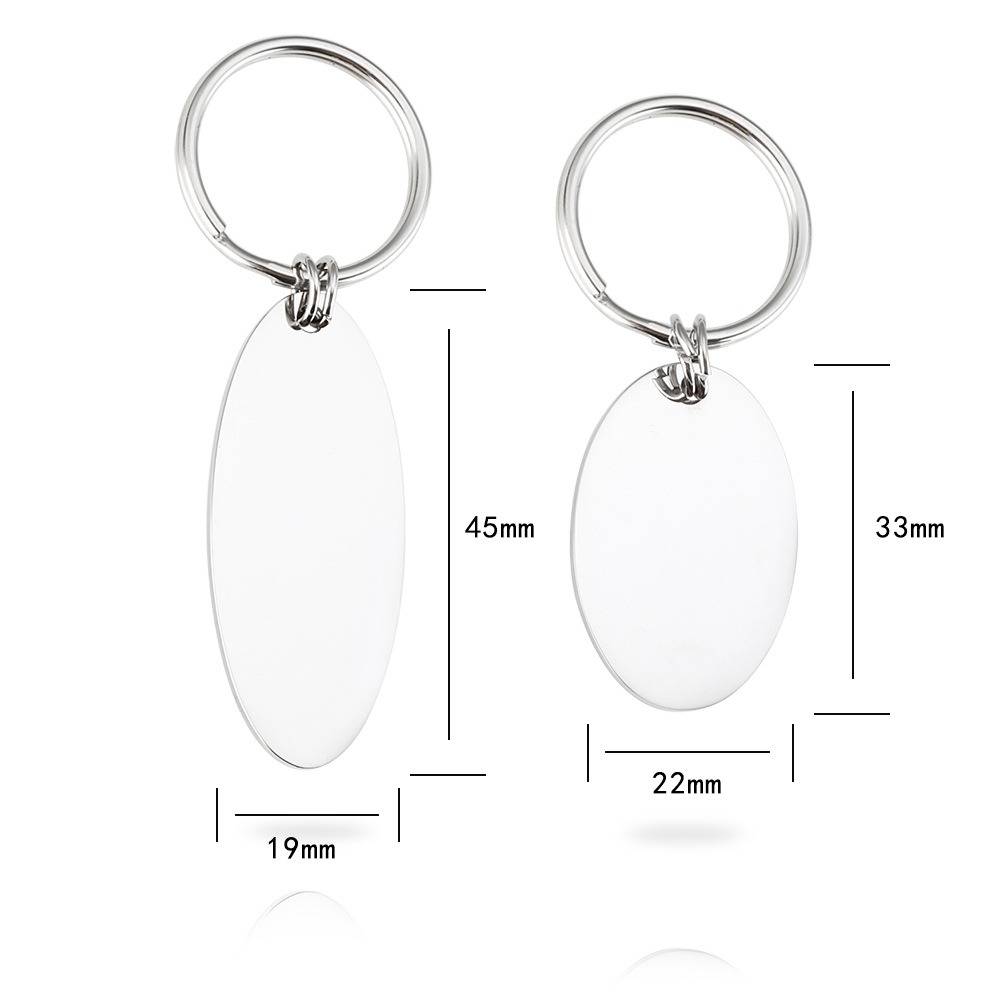 Polished oval stainless steel keychain engraved with a name and a single birthstone