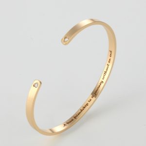 Open stainless steel cuff bracelet with a custom name engraved inside and an optional birthstone — Gold Tone