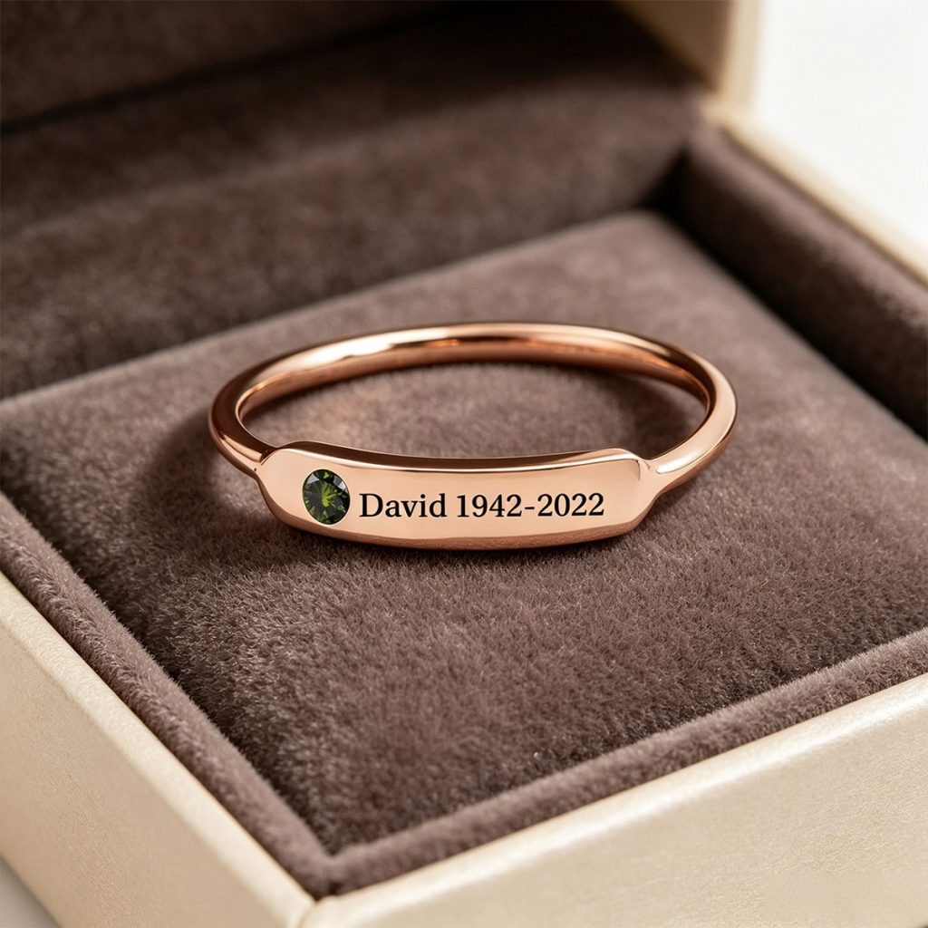 Minimalist stainless steel ring with cubic zirconia accent and one line of engraving