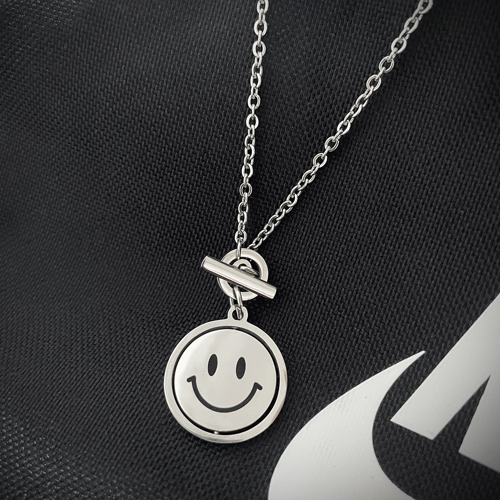 Rotating smile pendant necklace with a photo print