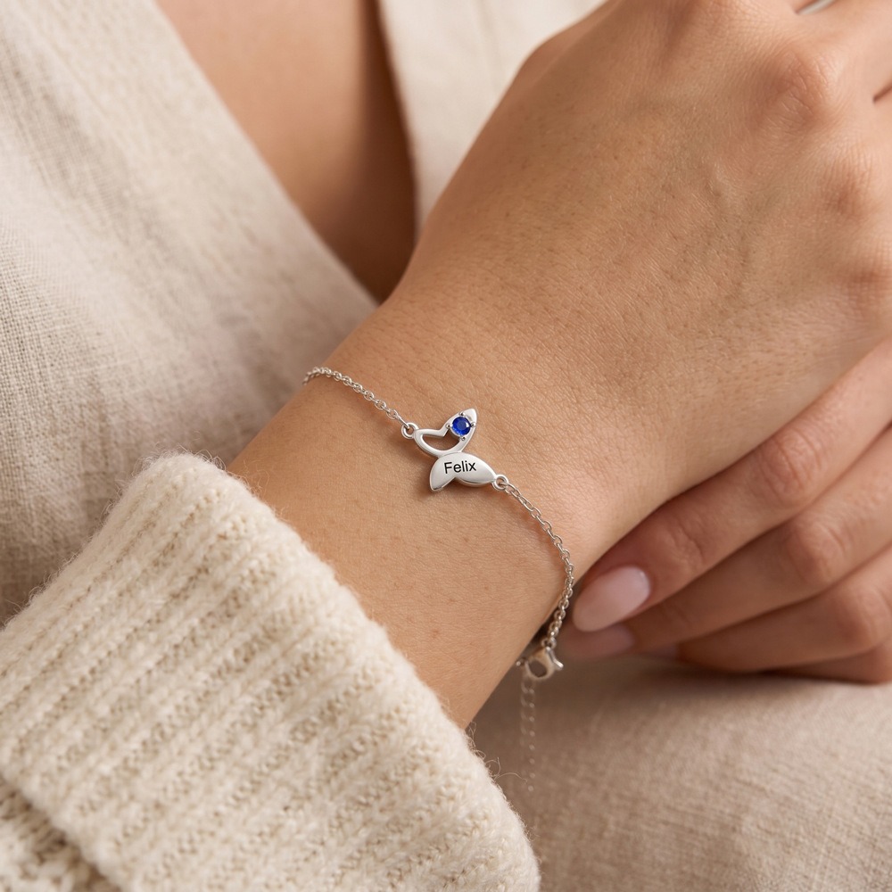 Butterfly bracelet with an engraved name and birthstone accent in gold tone