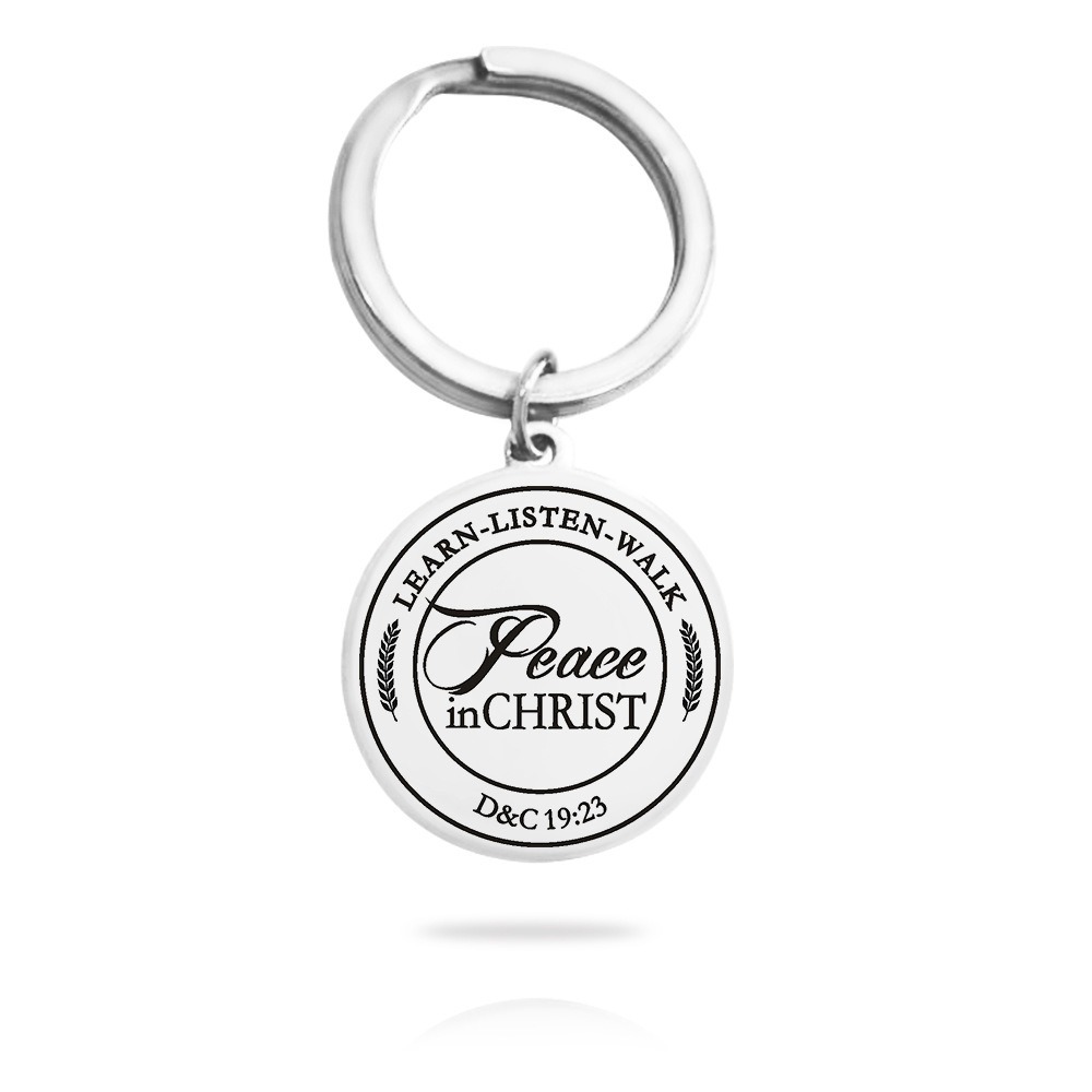 Stainless steel keychain with an engraved name and a small birthstone charm