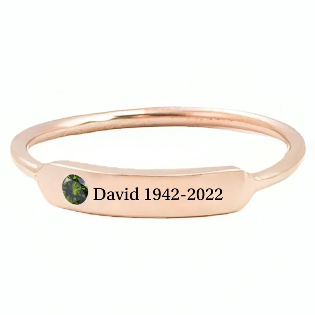 Minimalist stainless steel ring with cubic zirconia accent and one line of engraving