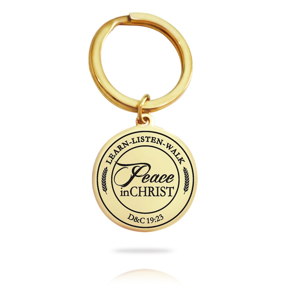 Stainless steel keychain with an engraved name and a small birthstone charm