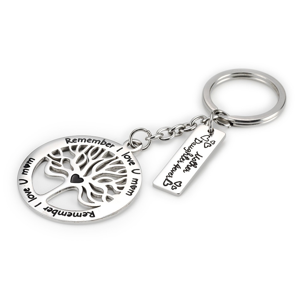 Steel life tree keychain with a single line of engraved text and one birthstone charm