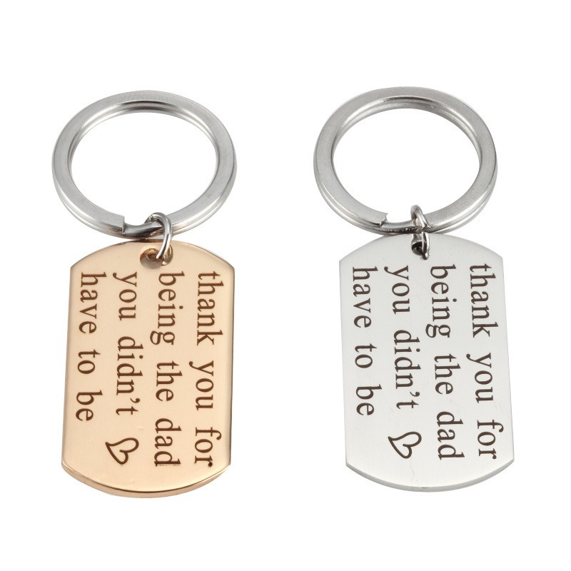 Engraved stainless steel dog tag keychain with a single birthstone accent