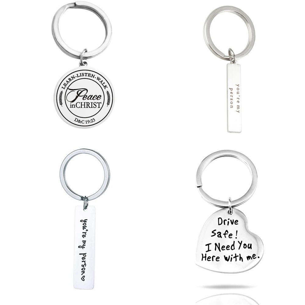 Stainless steel keychain with an engraved name and a small birthstone charm