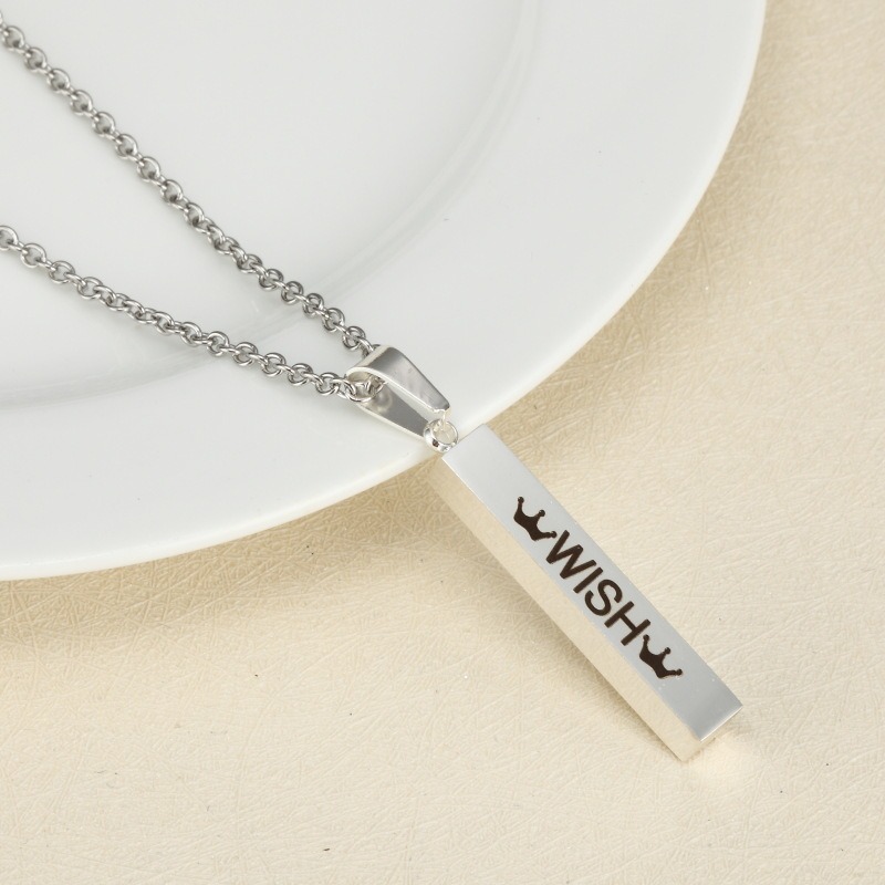 Vertical stainless steel bar necklace with custom single line engraving and optional birthstone, shown in gold tone