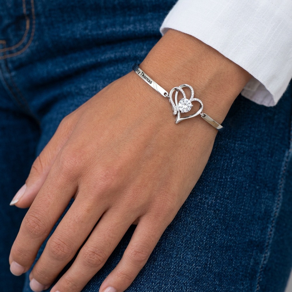 Stainless steel bracelet with two CZ heart charms engraved with names and birthstones