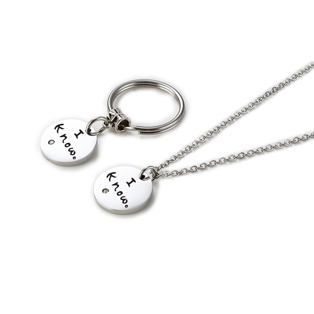 Stainless steel couple set with two engraved heart pendants, birthstones and a coil keychain