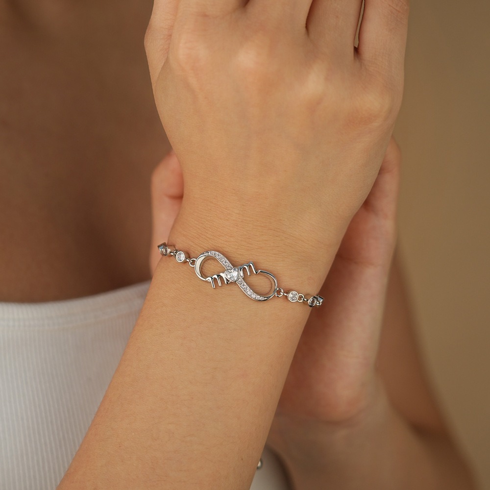 Stainless steel MOM infinity bracelet with single-line engraving and a birthstone accent