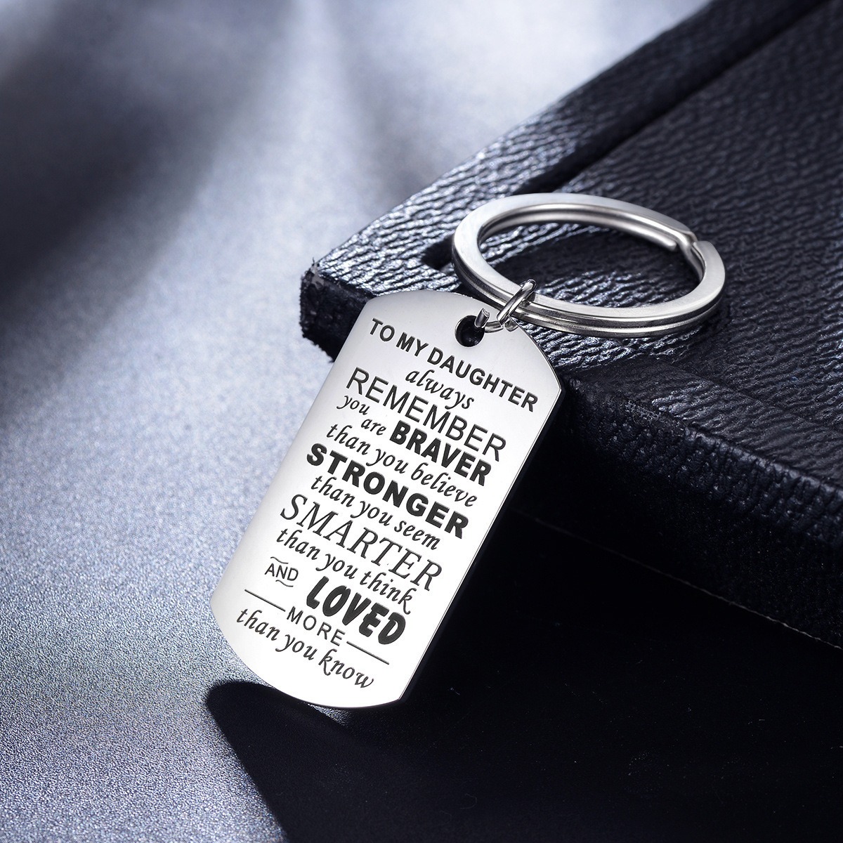 Engraved stainless steel dog tag keychain with a single birthstone accent